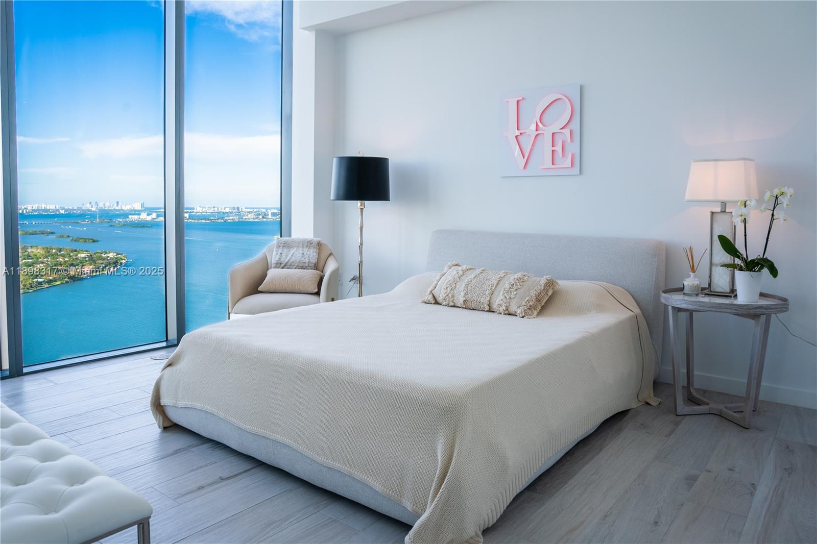 3131 Northeast 7th Avenue, Unit PH4903 Miami, FL 33137 - Photo 10 of 33 a bedroom with a bed and window