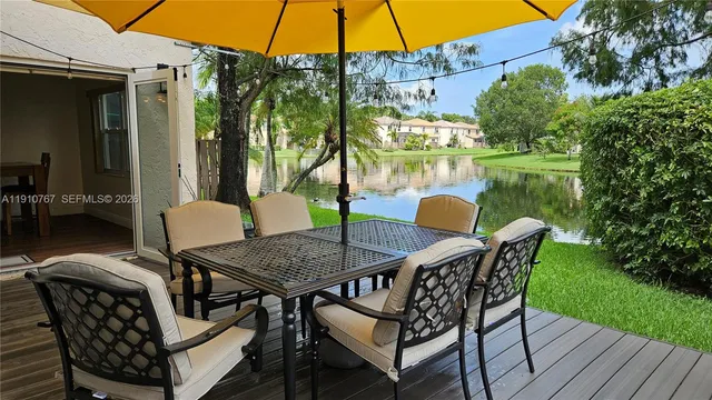 a patio with water table and chairs