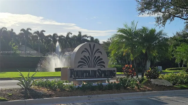 a view of a golf course with a lake
