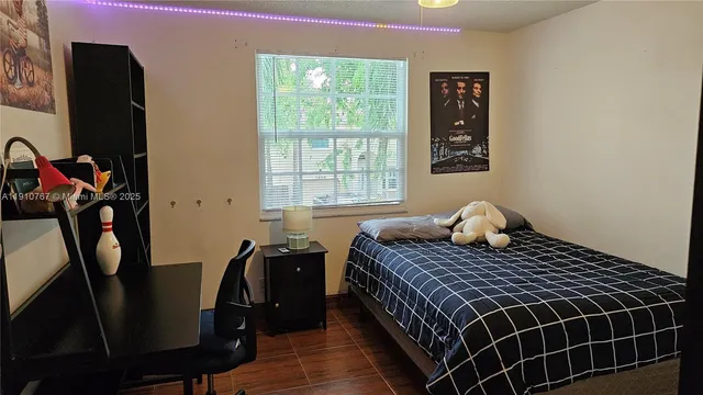 a bedroom with a bed and dresser