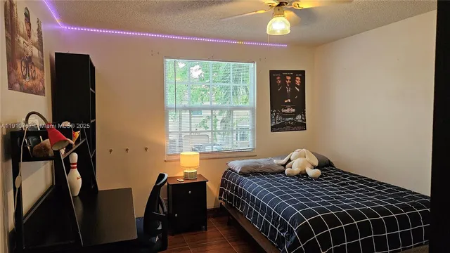 a bedroom with bed and a window