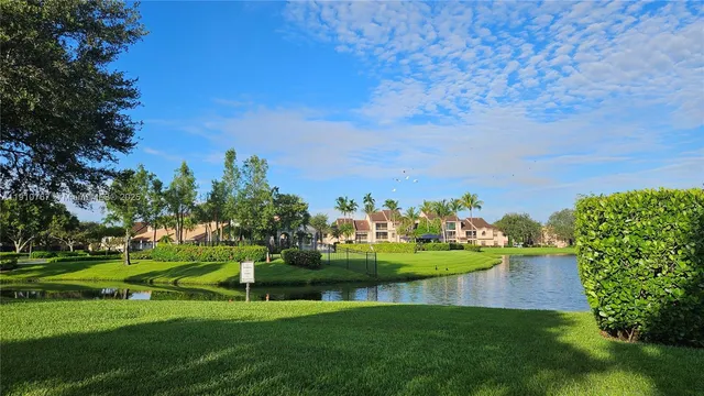 a view of a golf course with a lake