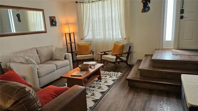 a living room with furniture and a window