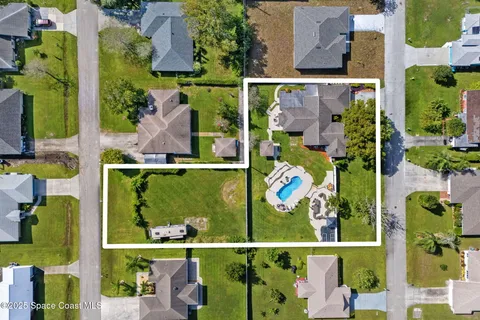 an aerial view of houses and roads