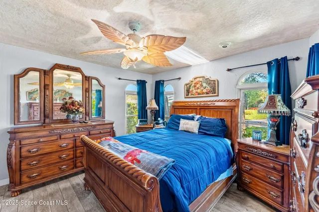 a view of a backyard with swimming pool