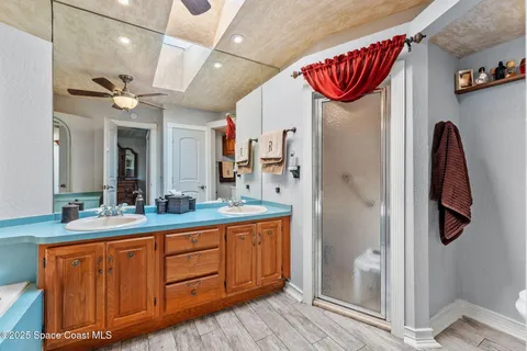 a view of a swimming pool with a patio and a yard