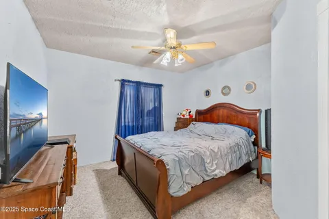 a view of a patio with dining table and chairs with plants