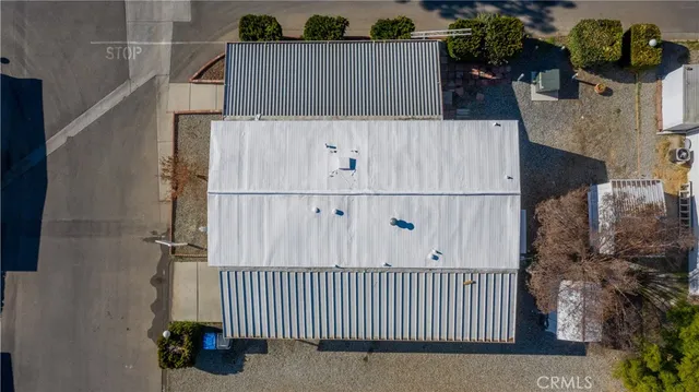an aerial view of multiple houses with yard