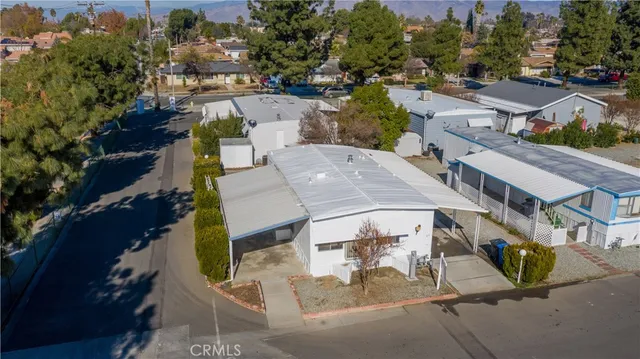 an aerial view of multiple houses with yard