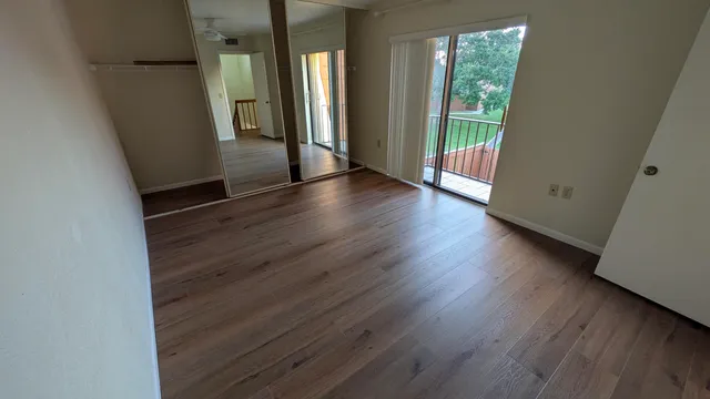 a view of front door with wooden floor