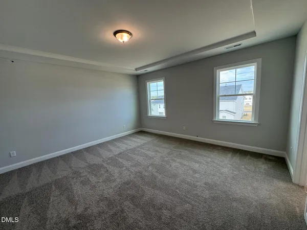 a view of staircase with wooden floor and white walls