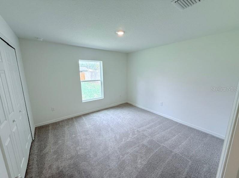39 Slipper Trail Palm Coast, FL 32164 - Photo 6 of 13 an empty room with window