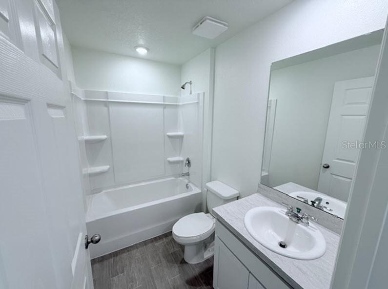 39 Slipper Trail Palm Coast, FL 32164 - Photo 7 of 13 a bathroom with a sink toilet tub and shower