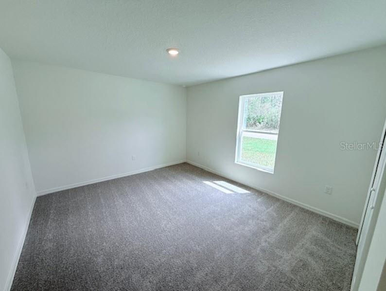 39 Slipper Trail Palm Coast, FL 32164 - Photo 10 of 13 an empty room with windows