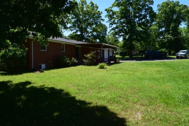 116 Black Road Dickson, TN 37055 - Photo 5 of 21 a backyard of a house with yard and tree