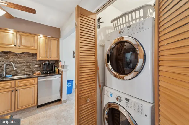 a view of a kitchen with washer and dryer