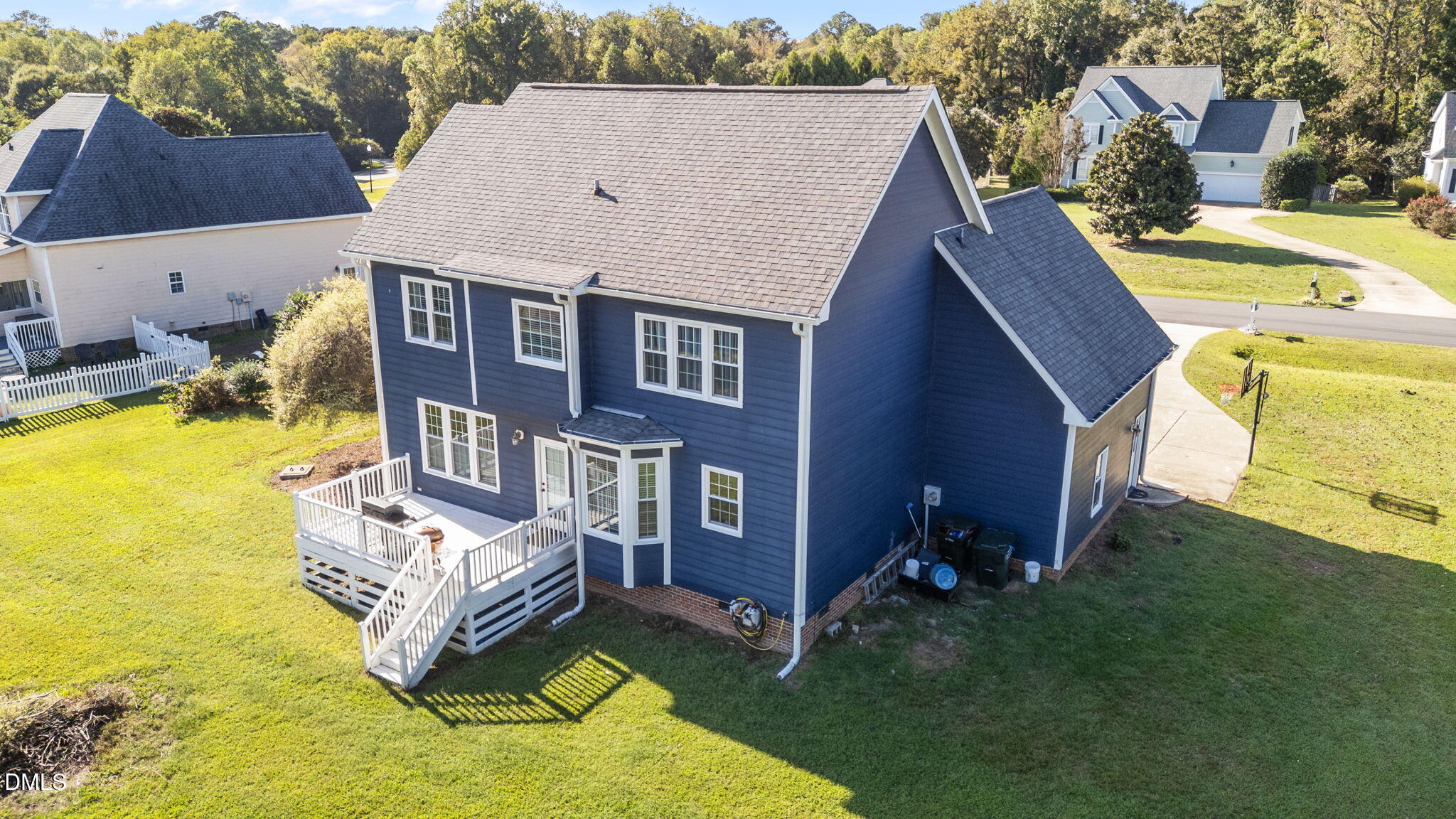 1617 Kendall Hill Road Willow Spring, NC 27592 - Photo 18 of 58 an aerial view of a house with swimming pool and a yard