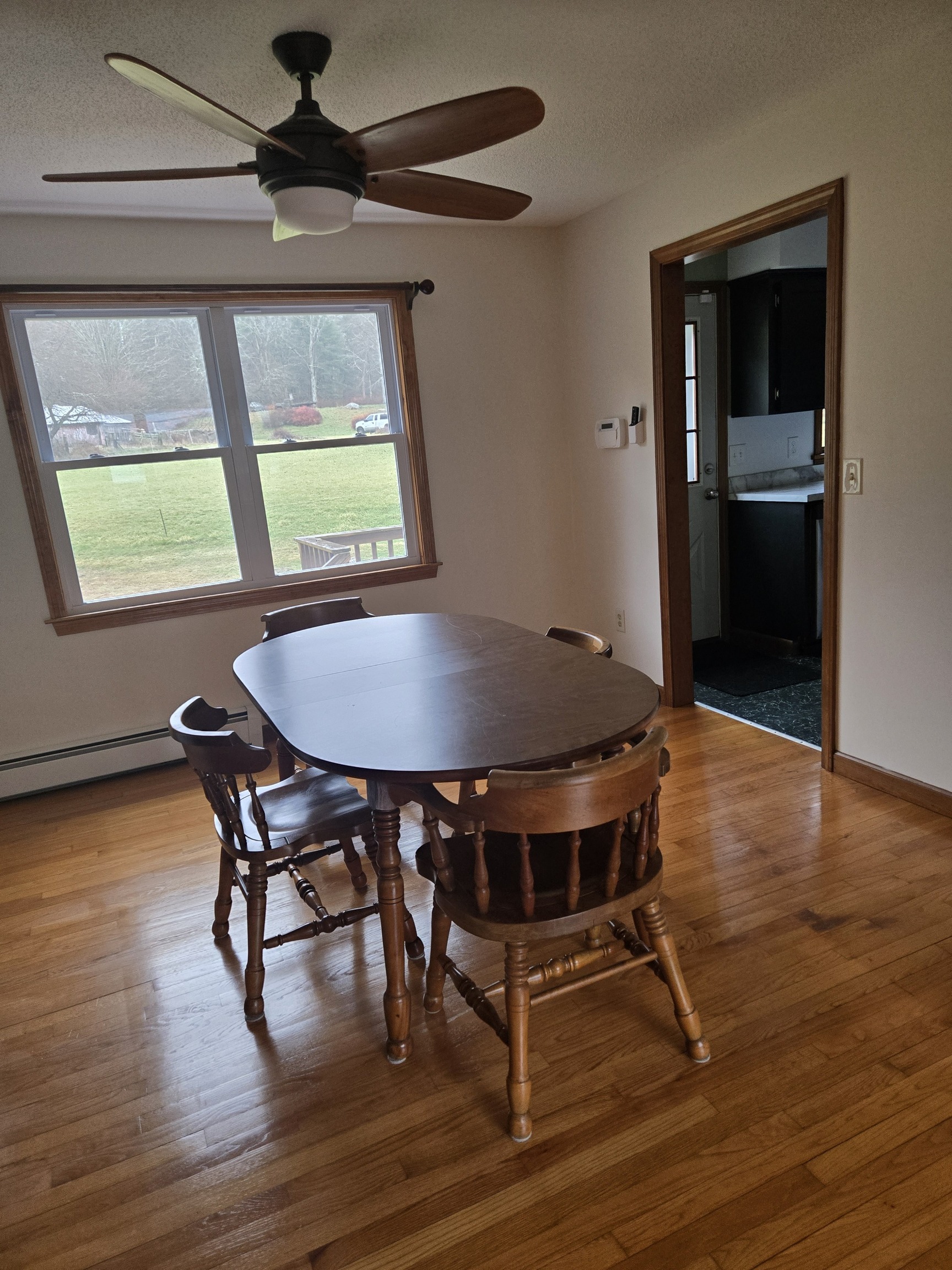 48 River Road Mansfield, CT 06250 - Photo 16 of 27 a view of a dining room with furniture window and wooden floor