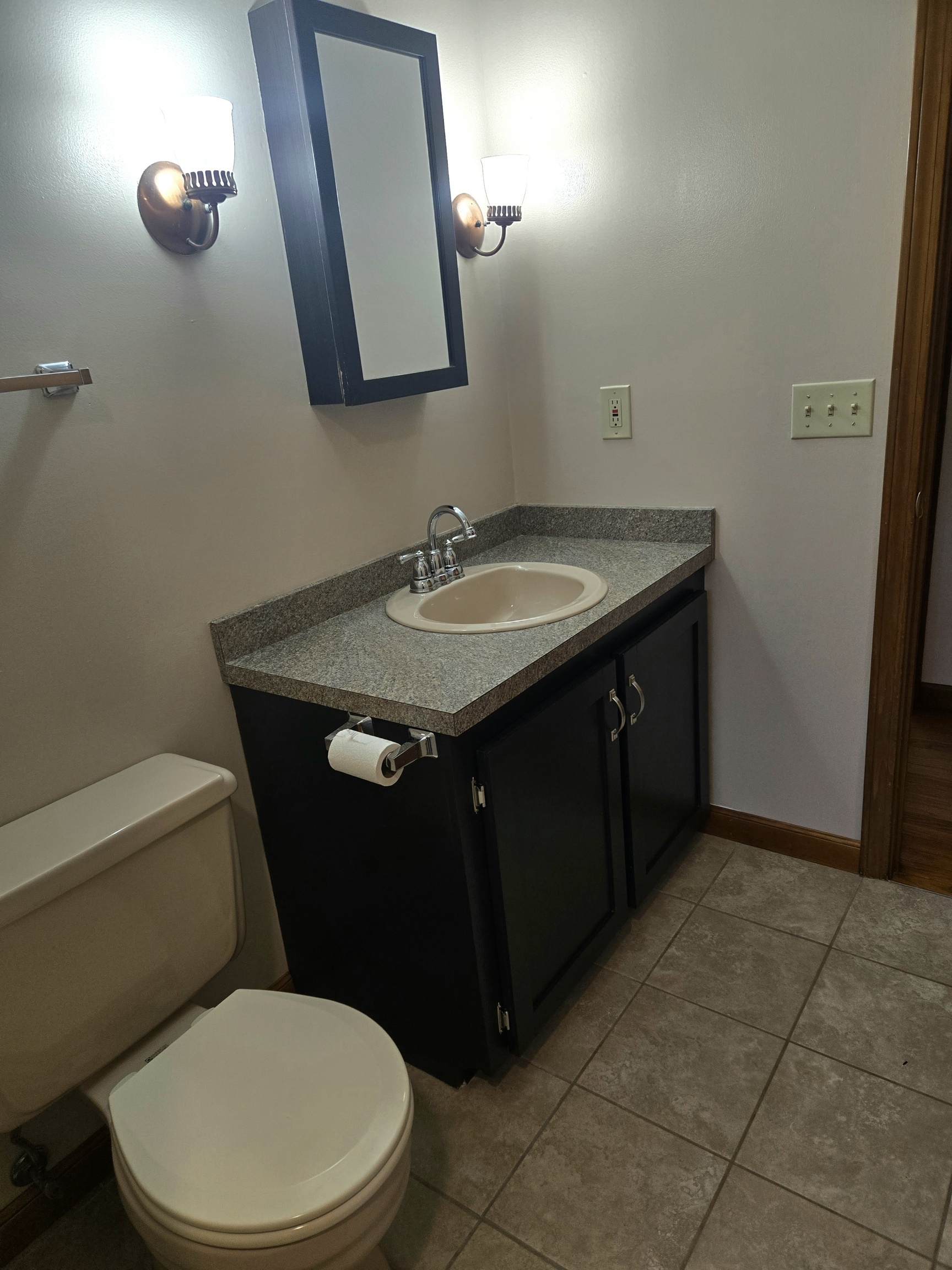 48 River Road Mansfield, CT 06250 - Photo 22 of 27 a bathroom with a granite countertop toilet sink and mirror