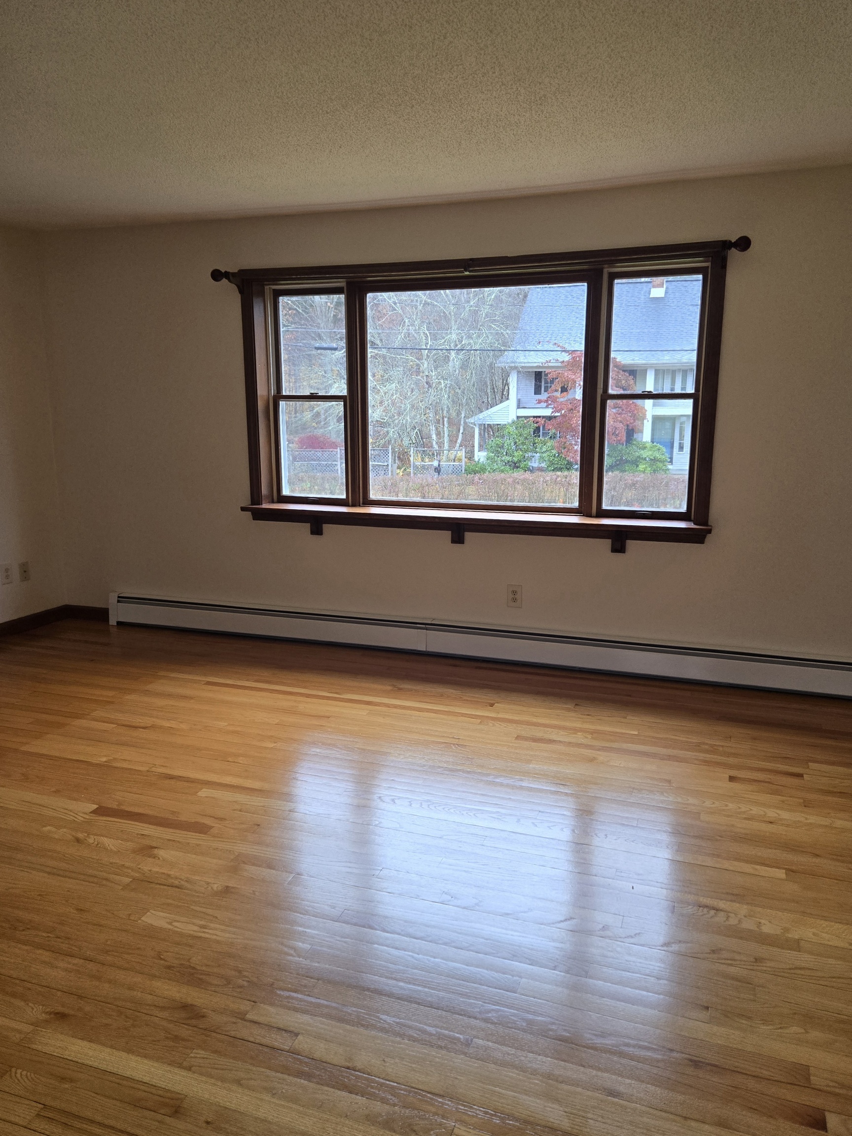48 River Road Mansfield, CT 06250 - Photo 5 of 27 a view of empty room with wooden floor and fan