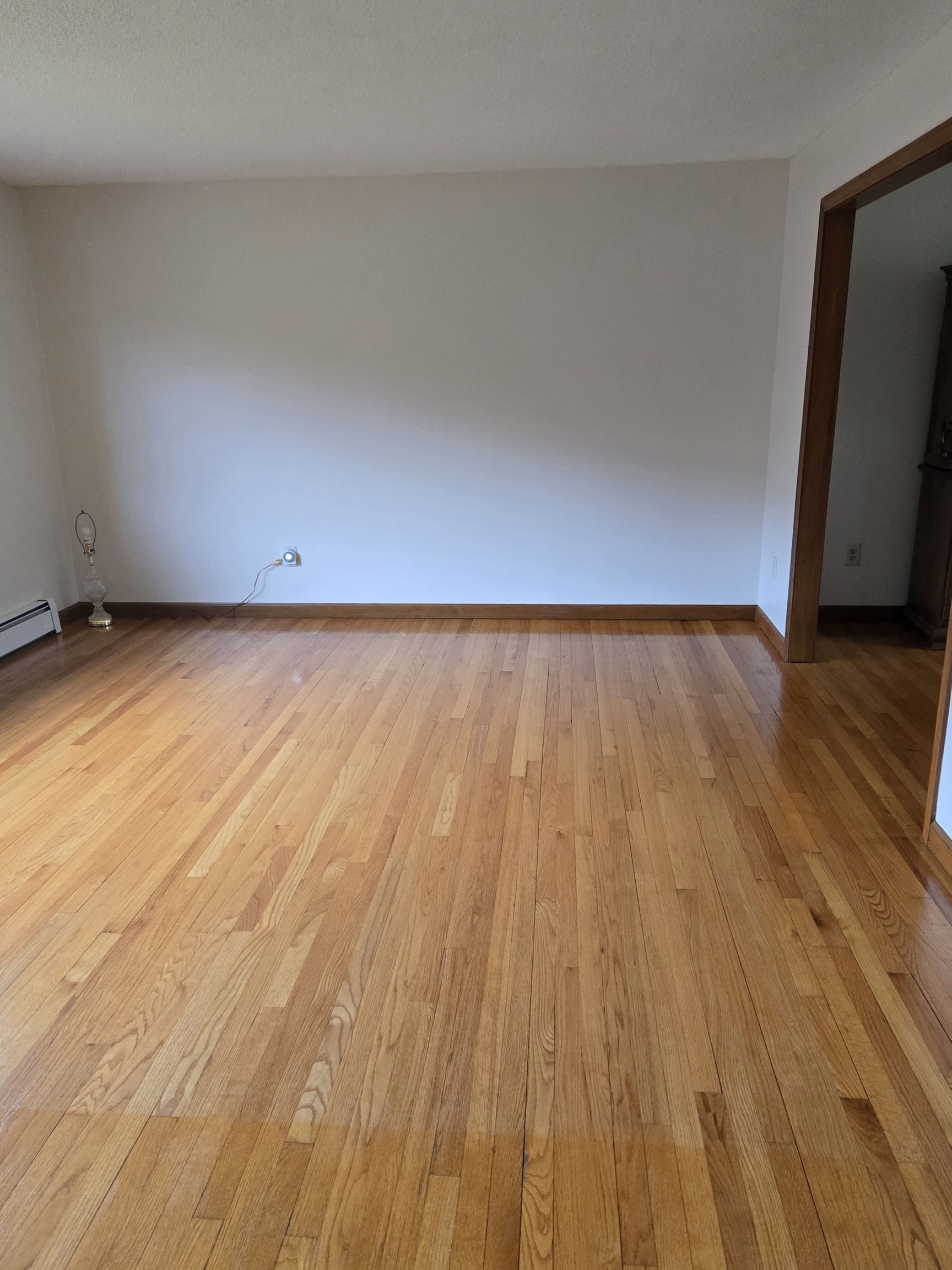48 River Road Mansfield, CT 06250 - Photo 7 of 27 a view of an empty room and wooden floor