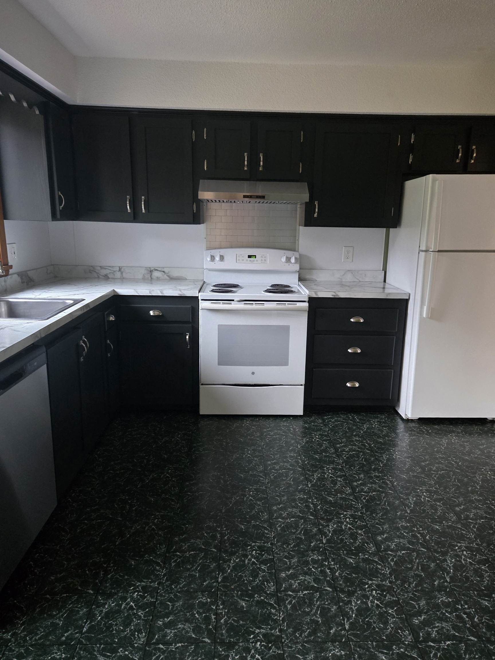 48 River Road Mansfield, CT 06250 - Photo 9 of 27 a kitchen with a sink and a stove