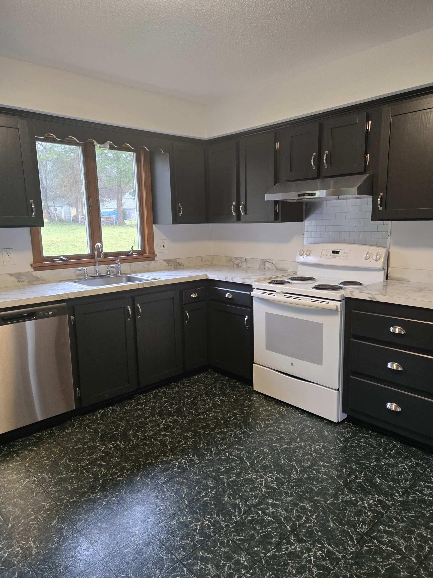 48 River Road Mansfield, CT 06250 - Photo 10 of 27 a kitchen with stainless steel appliances granite countertop a sink and a stove