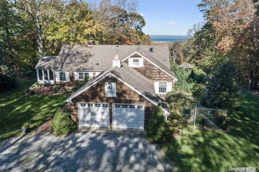 17 Crane Neck Road Old Field, NY 11733 - Photo 1 of 1 a aerial view of a house with a small yard and large trees