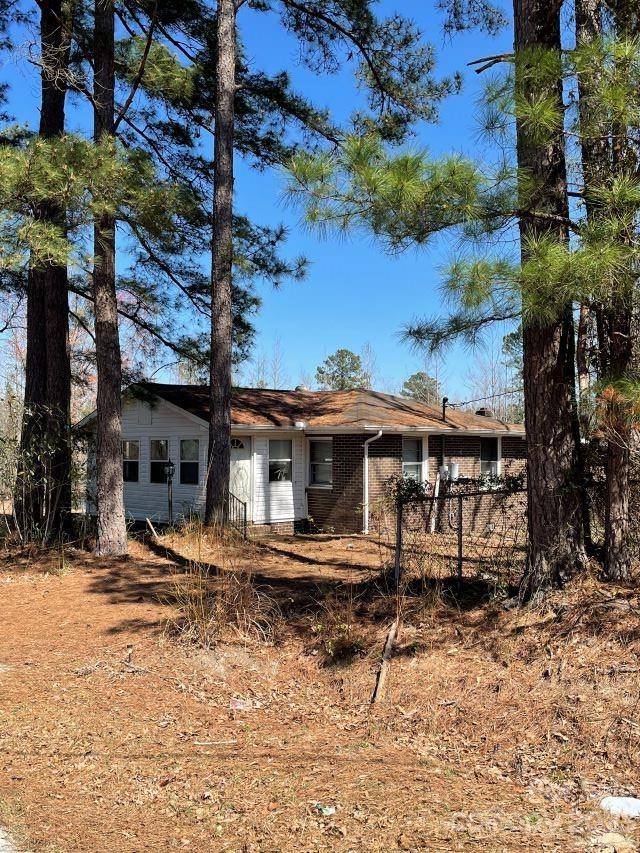 3240 Sam Jones Road Patrick, SC 29584 - Photo 1 of 35 front view of a house with a large tree