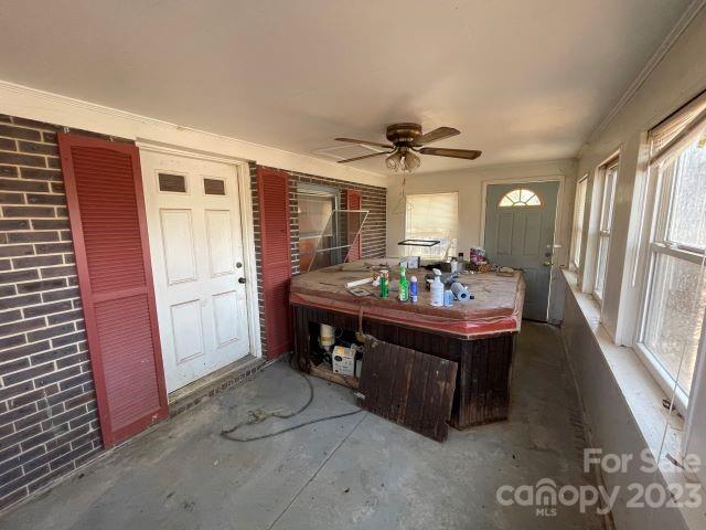 3240 Sam Jones Road Patrick, SC 29584 - Photo 18 of 35 a living room with furniture a dining table and a refrigerator
