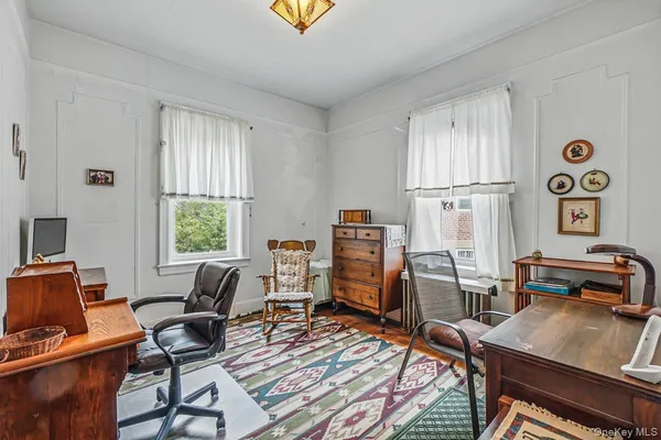 a workspace with furniture and a window