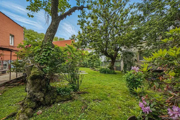 a backyard of a house with lots of green space
