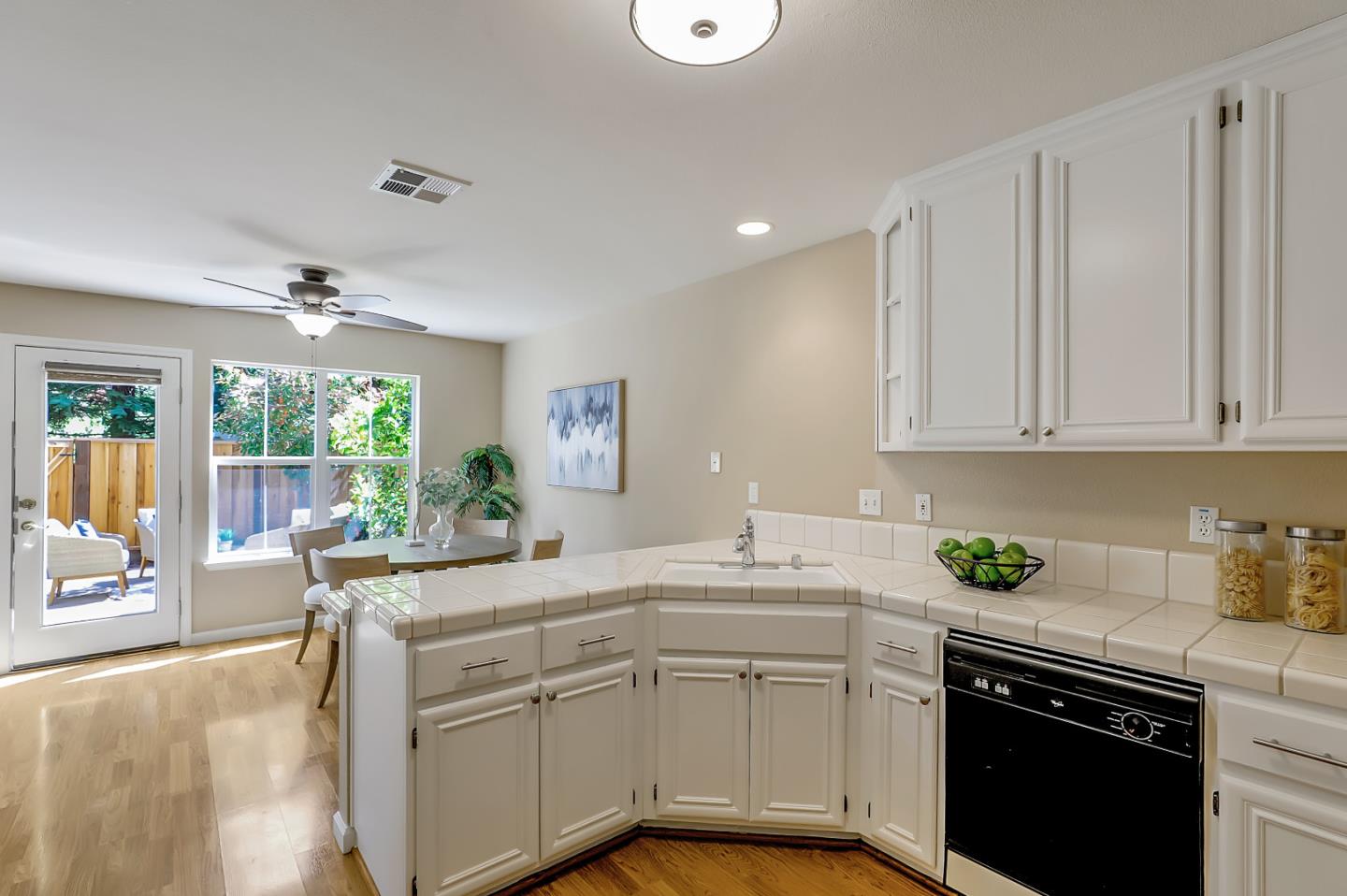 504 Weiner Way San Ramon, CA 94582 - Photo 12 of 41 a kitchen with a sink stove and cabinets