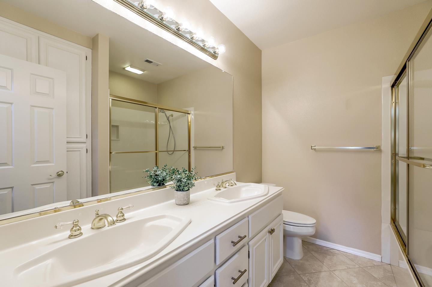 504 Weiner Way San Ramon, CA 94582 - Photo 25 of 41 a bathroom with a double vanity sink toilet and mirror