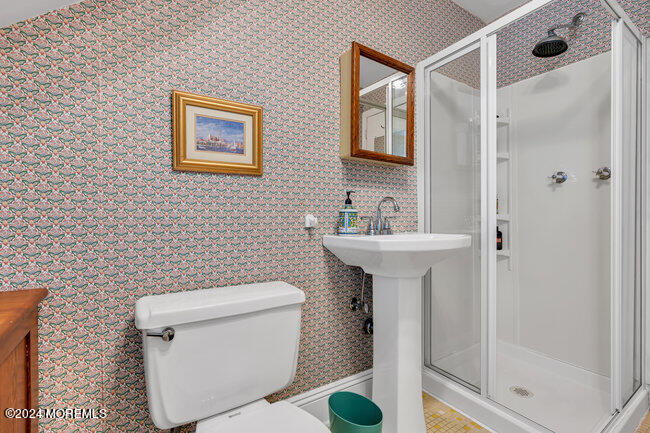 116 Washington Avenue Spring Lake, NJ 07762 - Photo 21 of 26 a bathroom with a sink toilet and shower