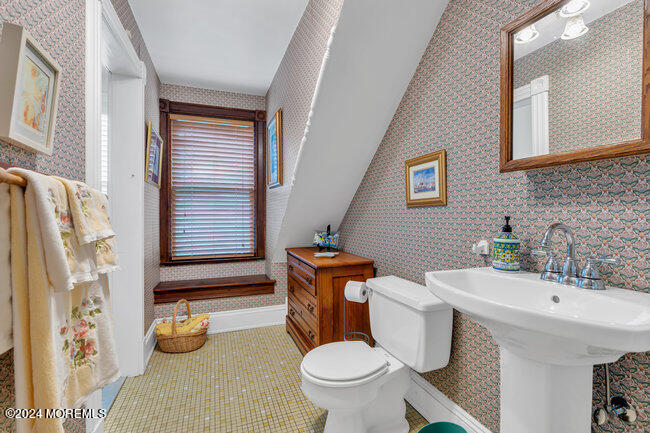 116 Washington Avenue Spring Lake, NJ 07762 - Photo 23 of 26 a bathroom with a sink a toilet and a shower