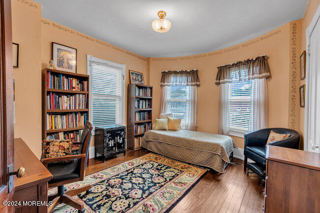 116 Washington Avenue Spring Lake, NJ 07762 - Photo 24 of 26 a bedroom with furniture and a book shelf