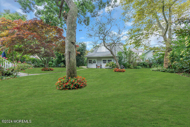 116 Washington Avenue Spring Lake, NJ 07762 - Photo 6 of 26 a front view of a house with garden