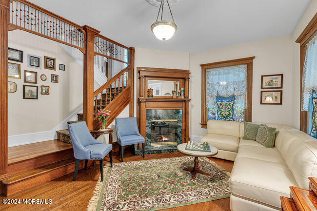 116 Washington Avenue Spring Lake, NJ 07762 - Photo 9 of 26 a living room with furniture a rug and a large window