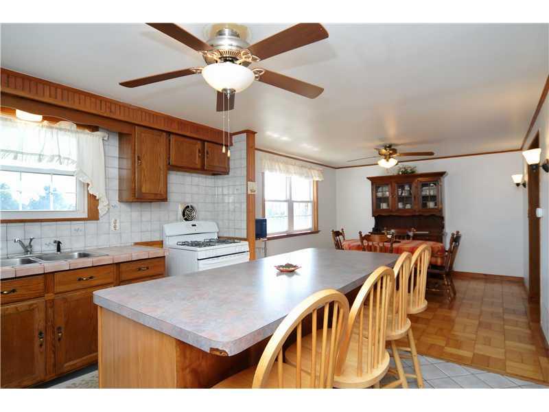4008 Firethorn Drive McKees Rocks, PA 15136 - Photo 6 of 22 Kitchen. LARGE KITCHEN ISLAND WITH STOOLS**CERAMIC TOWEL