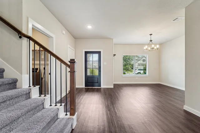 wooden floor in an empty room with a window and wooden floor