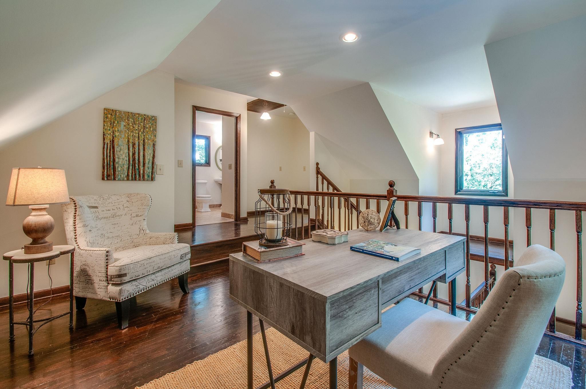 7426 Pinewood Road Franklin, TN 37064 - Photo 15 of 30 a living room with furniture and a wooden floor