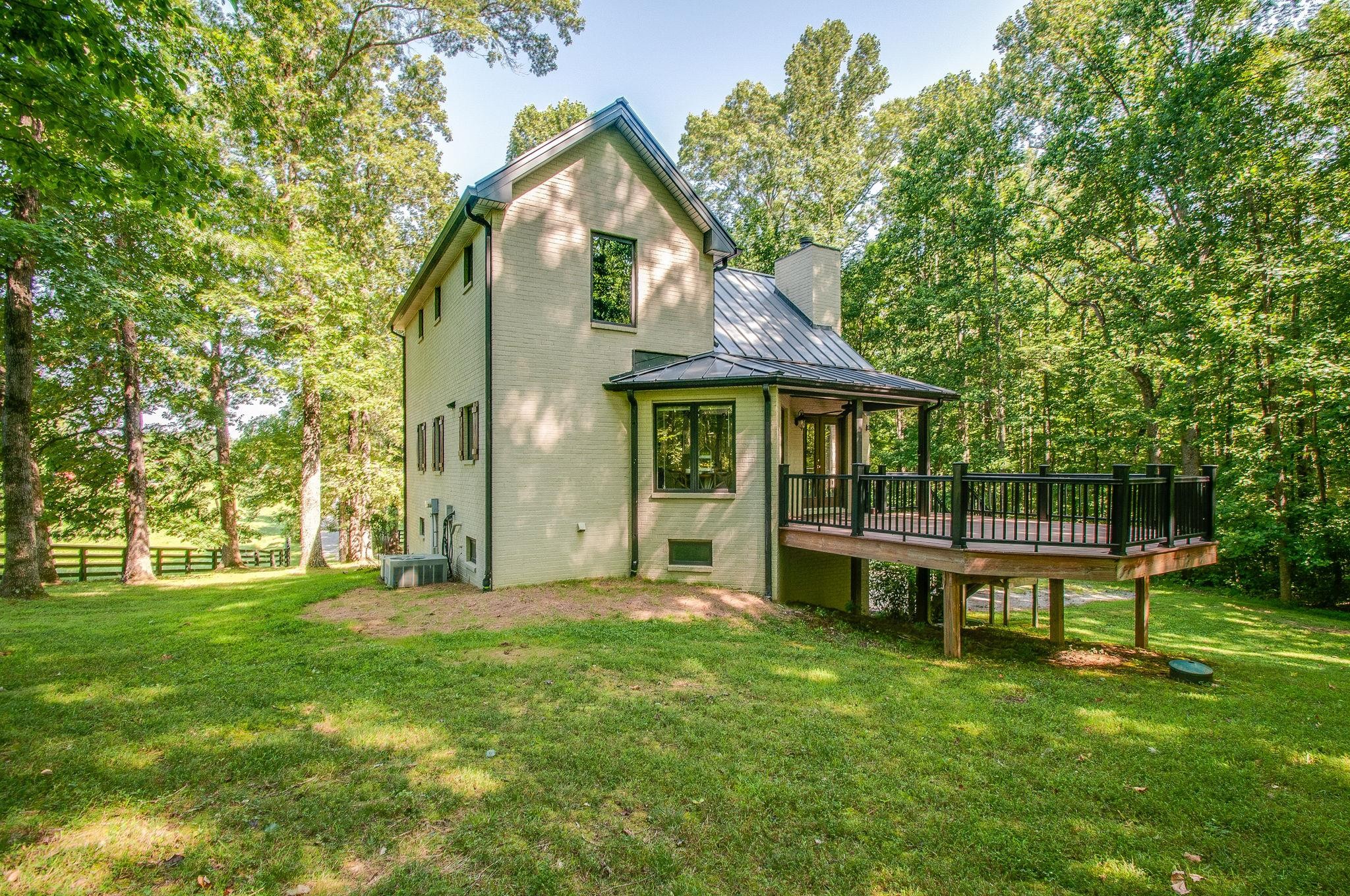 7426 Pinewood Road Franklin, TN 37064 - Photo 19 of 30 a view of a house with a yard and sitting area
