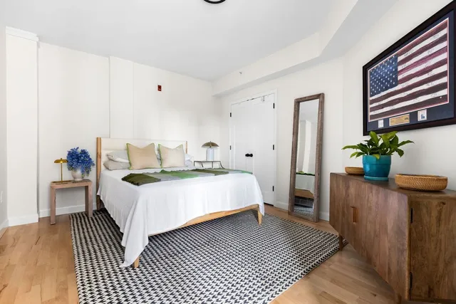 a bedroom with a bed and a dresser