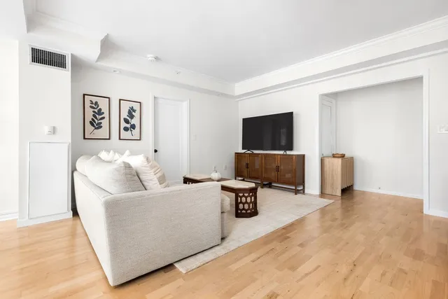 a living room with a couch and a flat screen tv