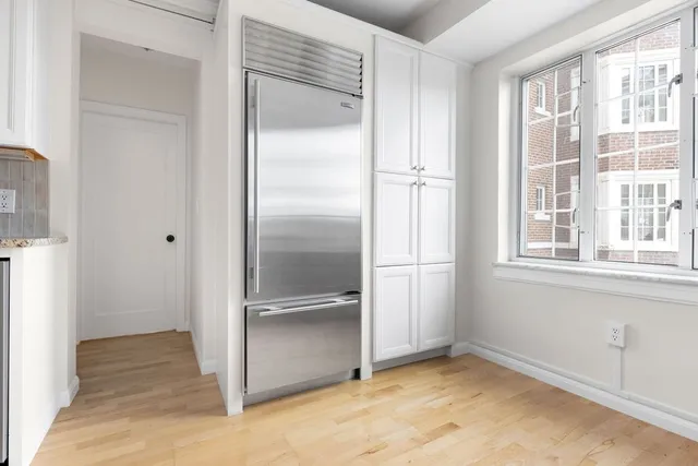a view of a refrigerator in a kitchen