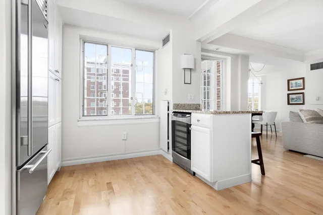 a kitchen with a stove a sink and a refrigerator