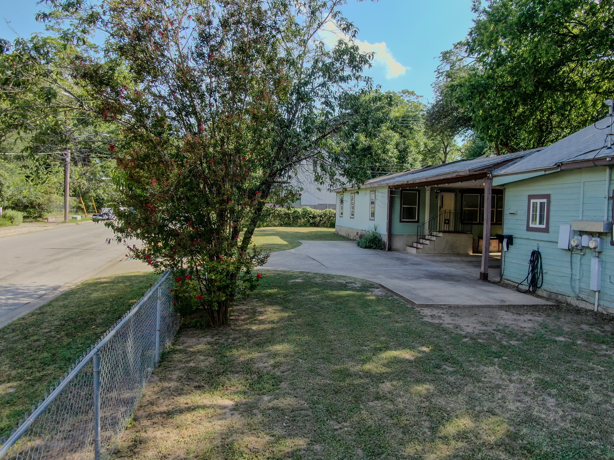 2015 Holly Street Austin, TX 78702 - Photo 24 of 24 A classic covered porch and concrete driveway welcome you to this charming single-story residence.