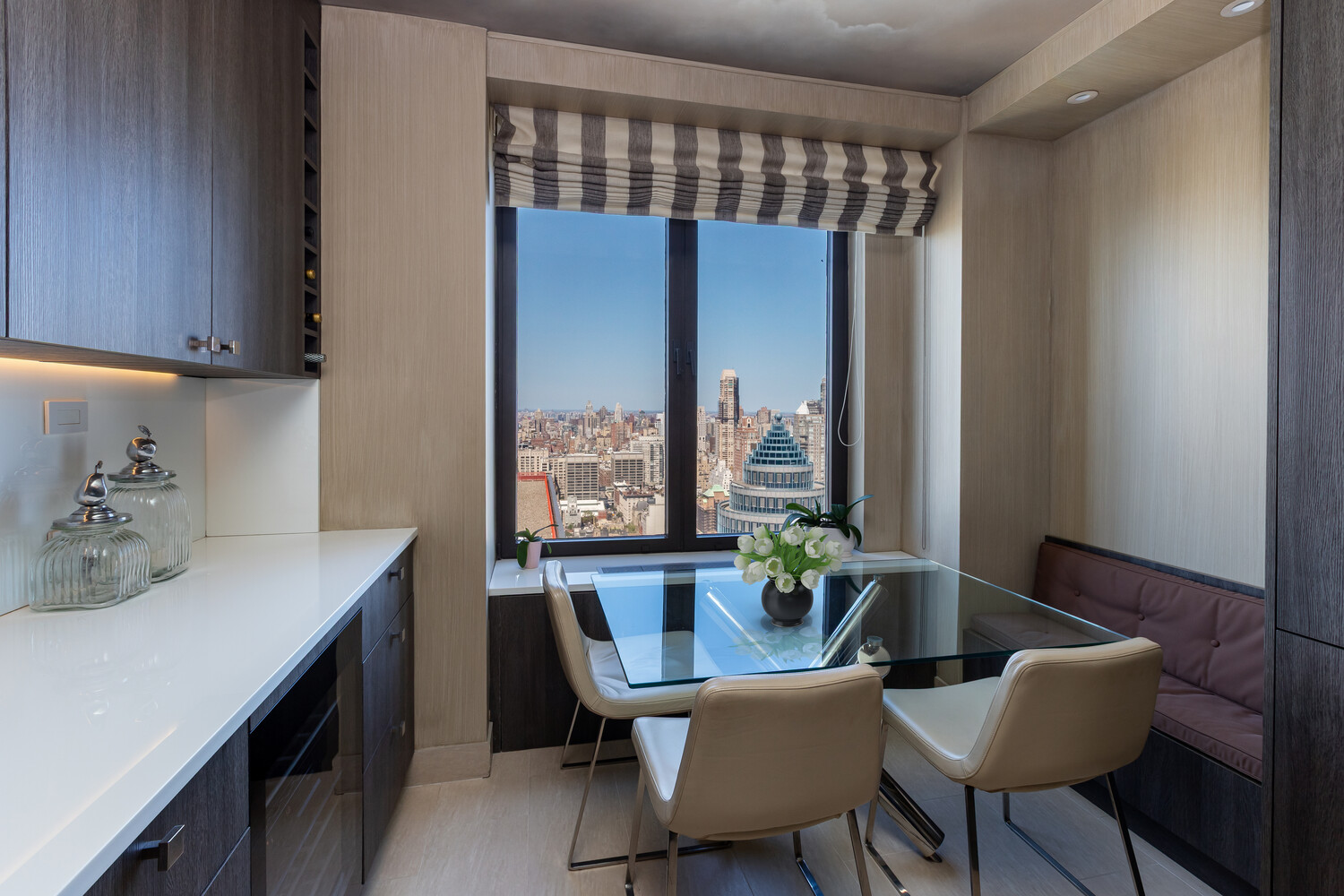 117 East 57th Street, Unit 49D/51D Manhattan, NY 10022 - Photo 9 of 46 a dining room with furniture and wooden floor