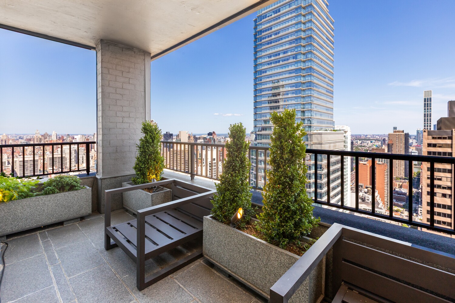117 East 57th Street, Unit 49D/51D Manhattan, NY 10022 - Photo 18 of 46 a view of a bench in the balcony